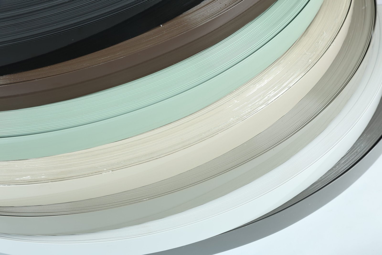 Assorted PVC edge banding samples for client presentations Assorted PVC edge banding samples for client presentations