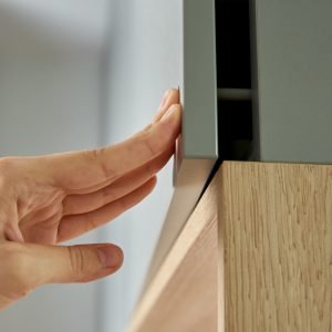 Female hand open kitchen cabinet, Cupboard door in kitchen furniture